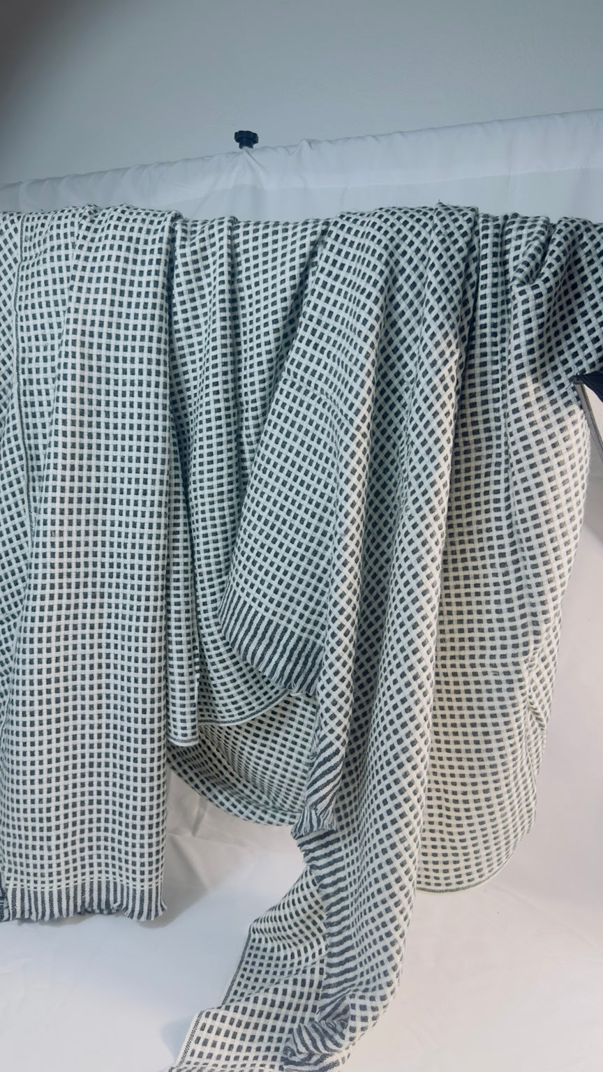 Black and ivory check cashmere blanket – Draped fringe view