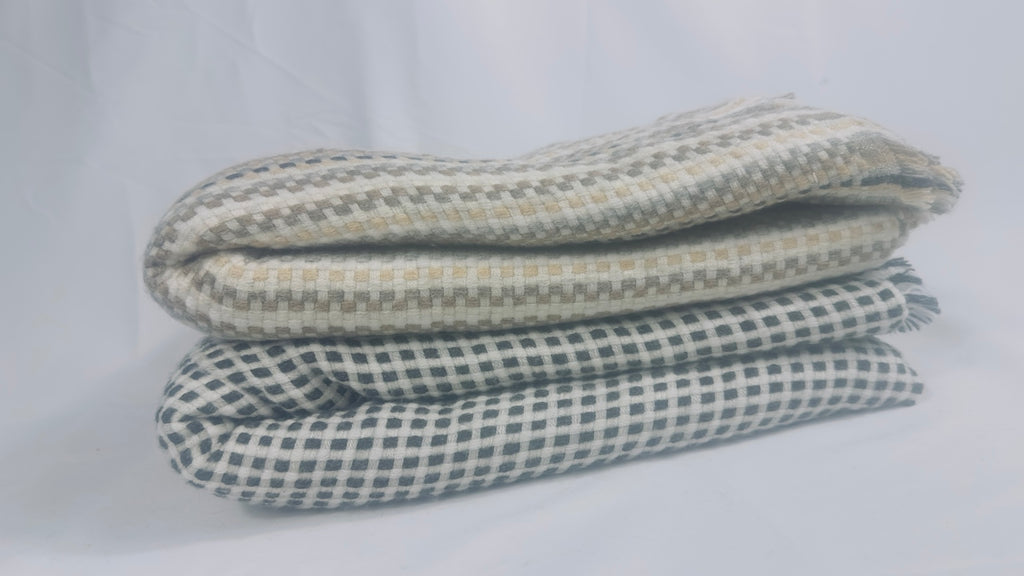 Both check cashmere blankets folded