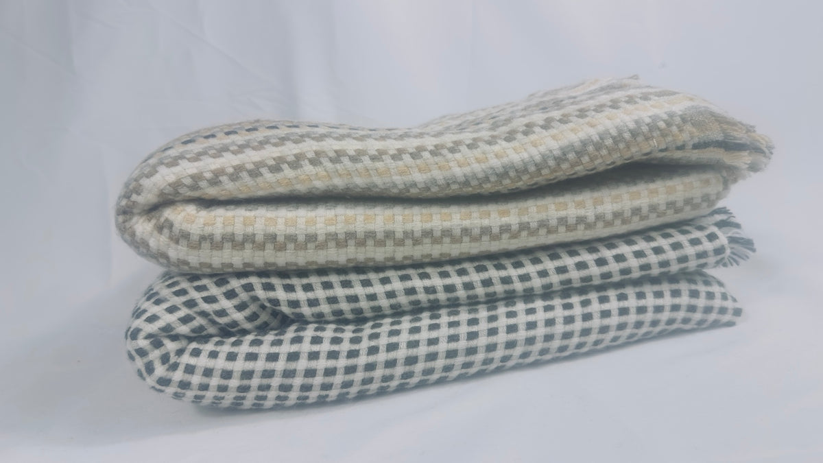 Both check cashmere blankets folded