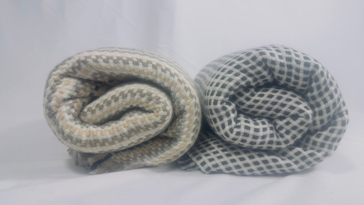 Both check cashmere blankets rolled