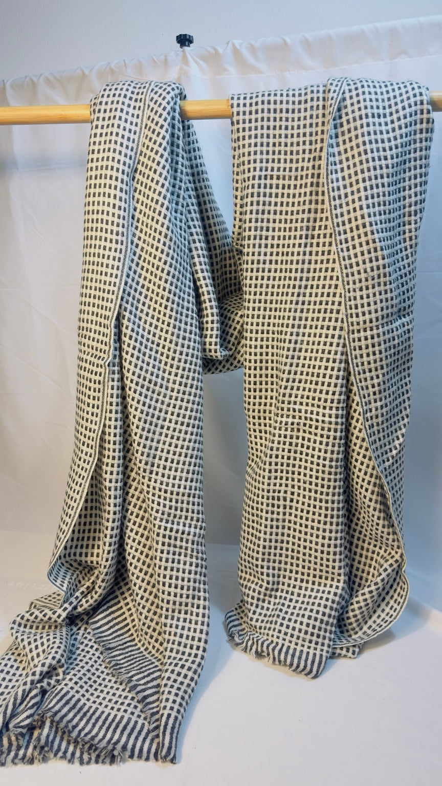 Black and ivory cashmere blanket draped view